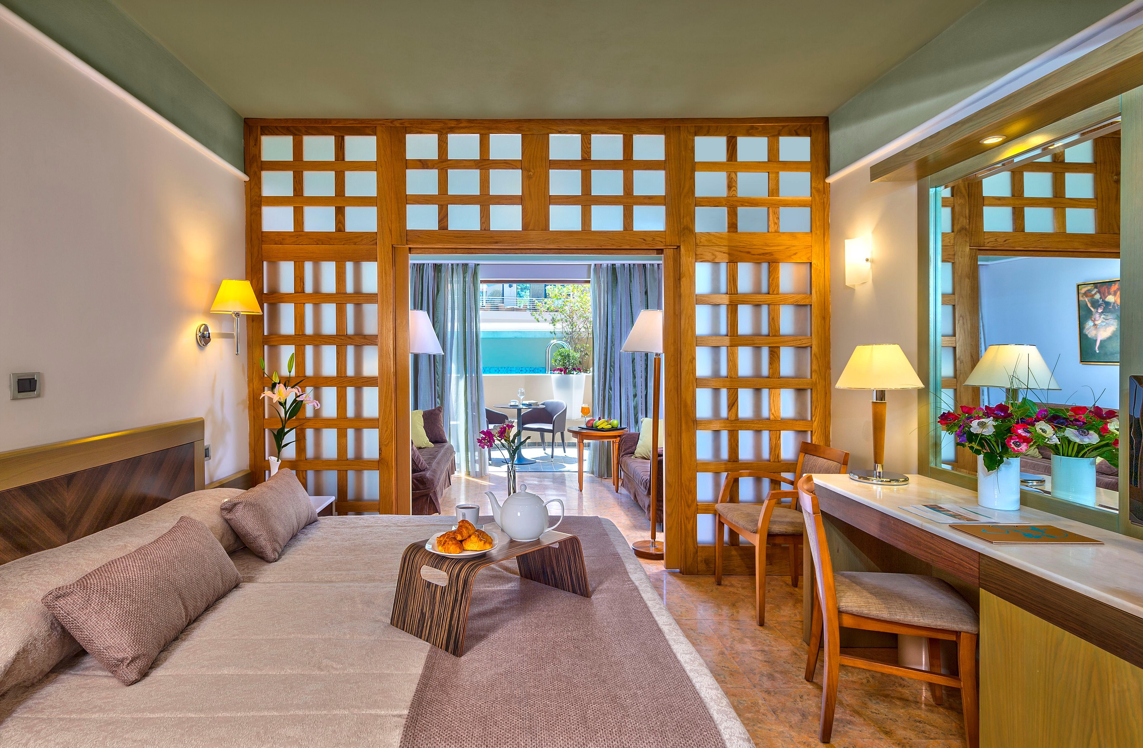 ปอร์โต ปลาตาเนียส บีช รีสอร์ต แอนด์ สปา Hotel ปลาเตเนียส ภายนอก รูปภาพ A room at the hotel